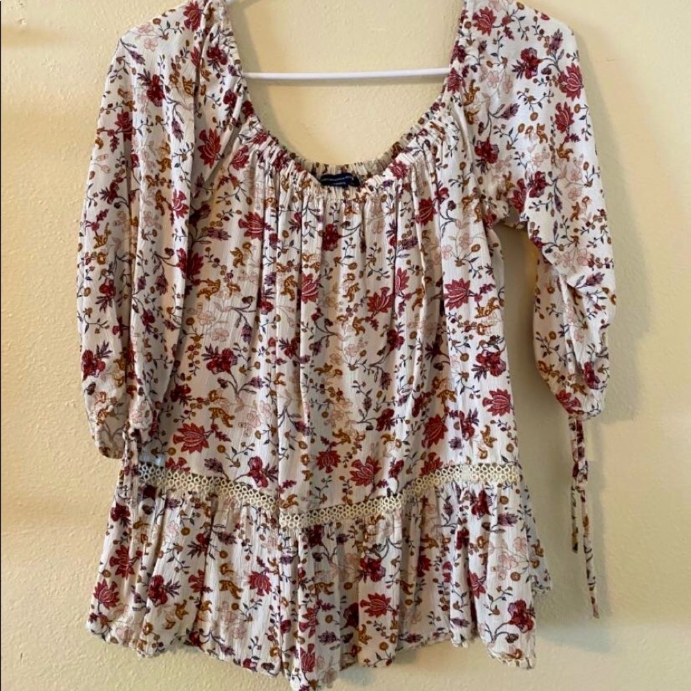 white and pink floral off the shoulder shirt